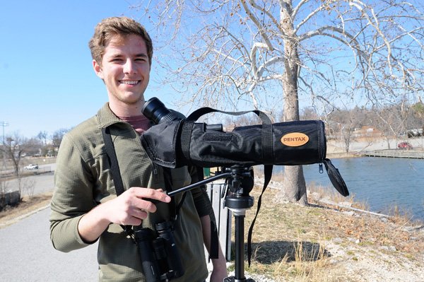 Mitchell Pruitt, a freshman at the University of Arkansas, hit the state’s highways and back roads to see and tally 311 bird species in one year. An amazing diversity of bird life across Arkansas helped Pruitt see so many species, he said. Here Pruitt is shown at Lake Fayetteville, one of his favorite places for birding. 