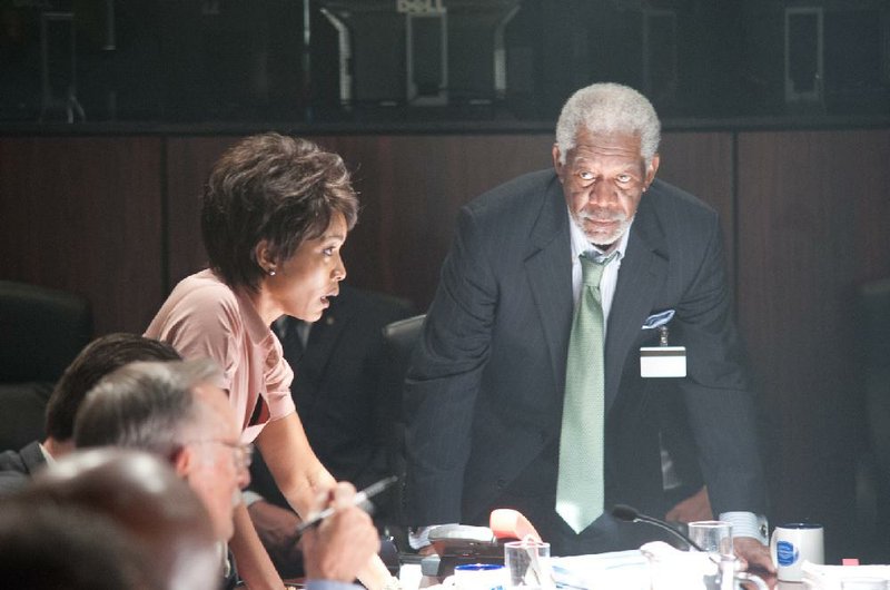 Secret Service Director Lynn Jacobs (Angela Bassett) gives the U.S. House Speaker Martin Trumbull (Morgan Freeman) the bad news in Antoine Fuqua’s action film Olympus Has Fallen.

