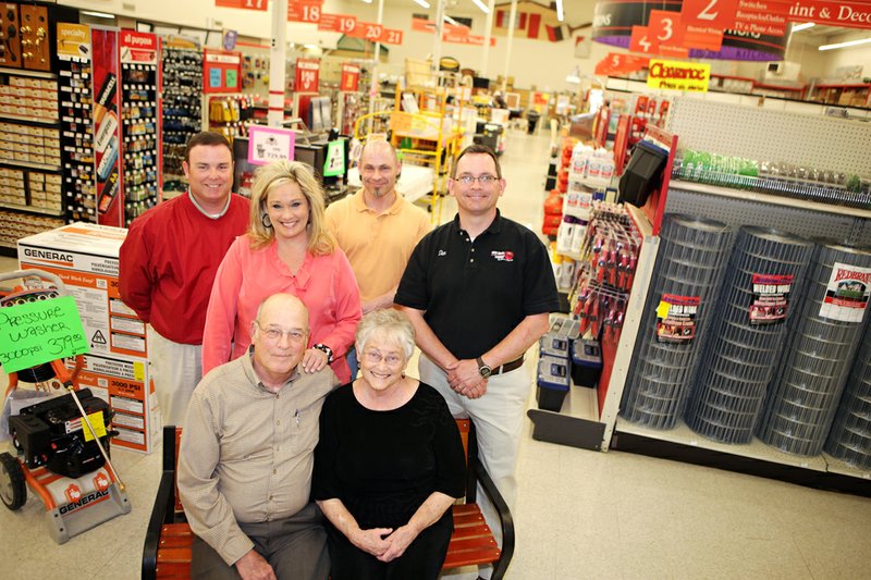 Whit Davis Lumber Plus, which is headquartered in Jacksonville, will celebrate its 60th anniversary on April 1. John Davis, front left, son of Whit Davis, and his wife, Sue, front right, owned the store for many years but recently transferred ownership to his children, back, from the right, Dan Davis, Paul Davis and Stacey Millar; and Terry Toney, president of the company.
