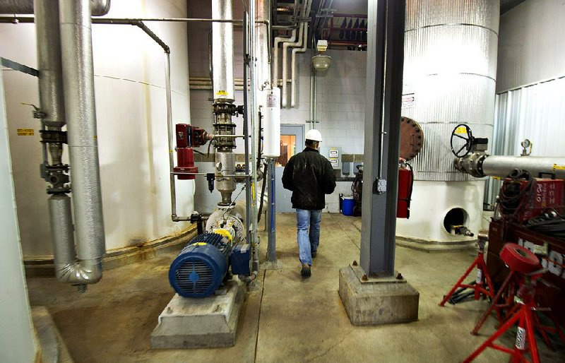 Brian Blotsky, lab and quality manager at the Great River Energy Blue Flint Ethanol plant, walks past an evaporator in Underwood, North Dakota, U.S., on Thursday, Feb. 9, 2012. North Dakota will hold its Republican presidential caucus on March 6. 