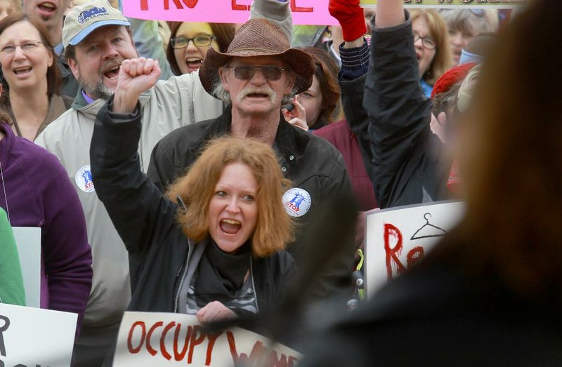 3/23/13
Arkansas Democrat-Gazette/STEPHEN B. THORNTON
Abortion rights protestors cheer as ACLU of Arkansas Executive Director Rita Sklar, right, speaks of fighting the constitutionality of recently passed Arkansas laws restricting abortions Saturday afternoon at the State Capitol in Little Rock.