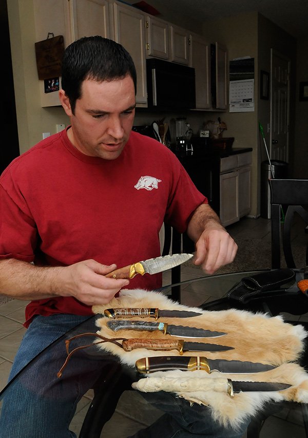 
Stephan Palmer lays out several knives     Friday March 22 2013    he has made over the years.