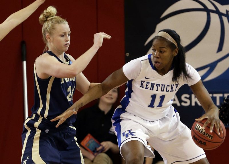 Navy’s M.L. Morrison (24) defends Kentucky’s DaNesha Stallworth (11) during the first half of Sunday’s first-round game in the women’s NCAA Tournament in New York. Stallworth finished with 18 points as the Wildcats, who struggled in the first half, topped the Midshipmen 61-41. 