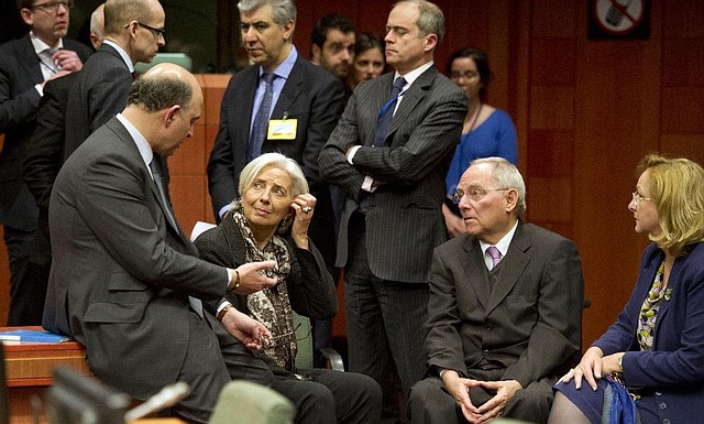 French Finance Minister Pierre Moscovici (from front left), Managing Director of the International Monetary Fund Christine Lagarde, German Finance Minister Wolfgang Schaeuble and Austria’s Finance Minister Maria Fekter talk during an emergency eurogroup meeting in Brussels on Sunday. 
