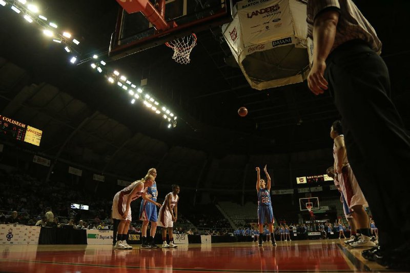 Teamwork is paramount in the game of basketball, but every free-throw shooter toes the line alone. During the Class 7A high school girls’ state championship March 8 at Barton Coliseum, Fort Smith Southside senior point guard Calli White shoots true at the free throw line. Northside won the game and the title in overtime, 51-46. 