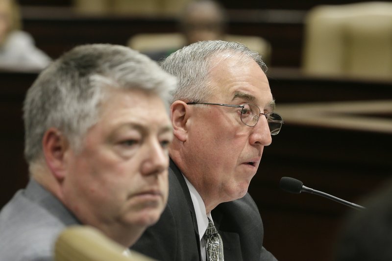 Consultant Phil Hopkins, right, of IHS Global Insight Steel Service, speaks on a proposed Arkansas steel mill during a meeting of the House and Senate Agriculture, Forestry and Economic Development Committees meeting at the Arkansas state Capitol in Little Rock, Ark., as IHS Director John Anton, left, listens Monday, March 25, 2013.
