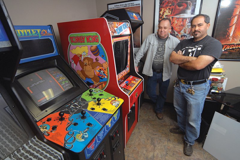Terry South, left, and Daniel Solis of Arcade Wizards are set to open Z82 Retrocade in Sherwood this summer. The pair currently host gamers through their Classic Gaming Association, which meets once a month at the Arcade Wizards shop in Sherwood. The shop holds more than 100 different games.