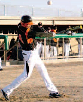 Gravette's Ethan Vanderpool pops one up foul in play on March 5 at Gravette's new baseball stadium.