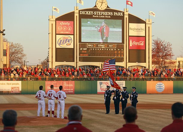 Fans pack into the stadium to stand for the National Anthem at the start of the Arkansas Razorbacks game against Mississippi Valley State Wednesday night at Dickey-Stephens Park in North Little Rock.