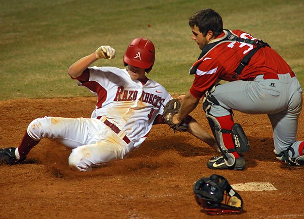 Mississippi Valley State's catcher German Hays tags out Arkansas Razorbacks' Brian Anderson at home in the seventh inning Wednesday night at Dickey-Stephens Park in North Little Rock.