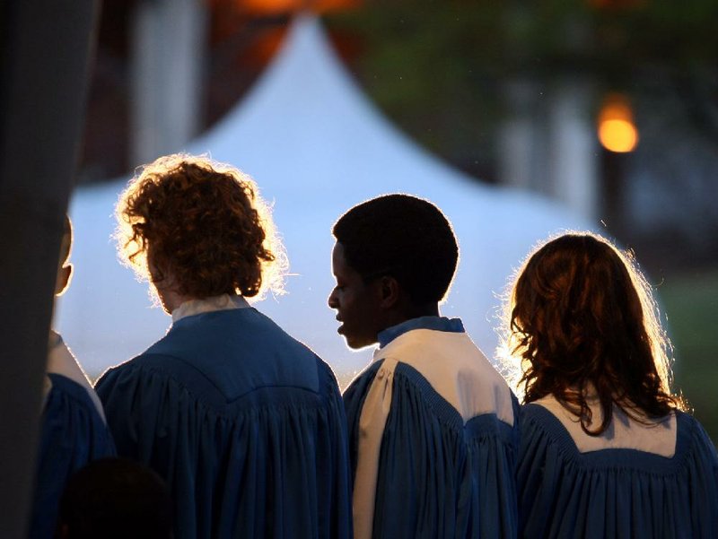 Arkansas Democrat-Gazette/RICK MCFARLAND--04/04/10-- Members of the Parkview Arts and Science Magnet School Madrigals and Lab Singers perform druing the Easter Sunrise Service at Riverfront Park in Little Rock Sunday.  