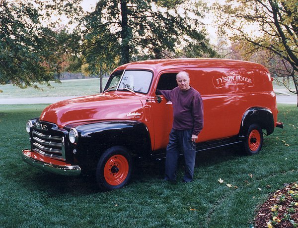 Joe Fred Starr stands next to his GMC panel truck that was used for parades. 