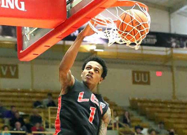 Lee College's Jamal Jones dunks the ball during the first round game against Hagerstown Community College at the NJCAA men's championship basketball tournament at the Sports Arena. Lee beat Hagerstown 104-97 and Jones scored 25 points in the game. 