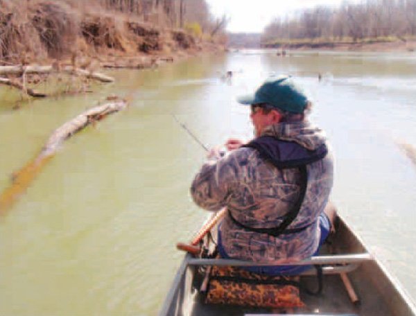 Ron Duncan of Springdale has high hopes for a walleye while fishing on the White River near Goshen during a float trip March 15. Several crappie took a liking to Duncan’s lures, but the walleye refused to bite. 