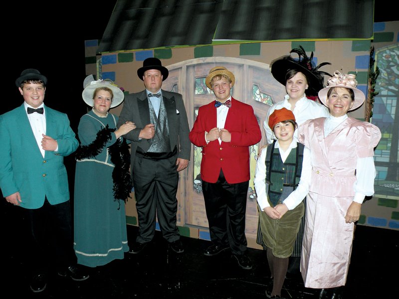 Appearing in the Clinton High School production of The Music Man are, front row, from the left, Chase Blanton as Marian’s brother, Winthrop Paroo, and Lorna Nulph as Marian’s mother, Mrs. Paroo; and back row, from the left, Josh Pryor as Marcellus Washburn, Debbie Pryor as Eulalie M. Shinn, Kirk Pryor as Mayor Shinn, Caleb Pryor as “Professor” Harold Hill and Catie Ward as Marian Paroo.