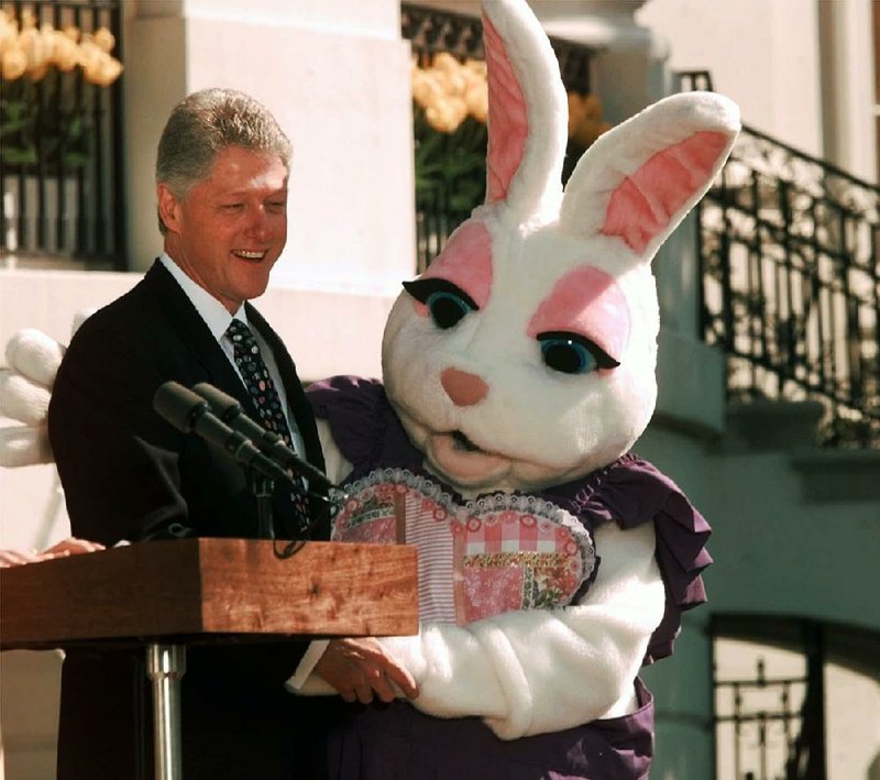 President Bill Clinton poses with a rather frisky Easter Bunny on April 13, 1998, at the White House. The episode spawned a boom in pet rabbits. 