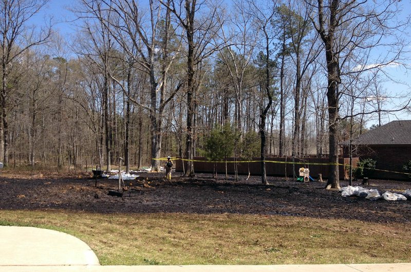 Crews work Monday, April 1, 2013, in Mayflower at the site of a ruptured Exxon Mobil oil pipeline.
