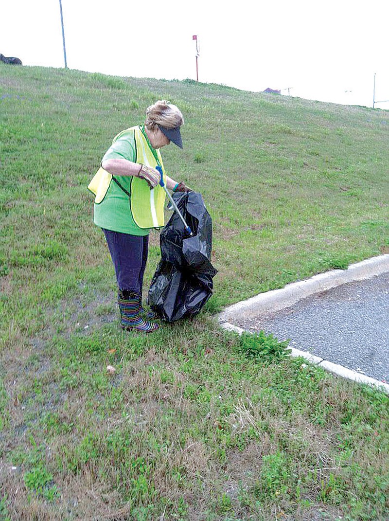 Linda Chandler, a member of the Keep Bryant Beautiful Board, picks up trash during the organization’s citywide cleanup day last fall. Keep Bryant Beautiful strives to beautify the community and reduce the amount of litter found on the city’s streets.