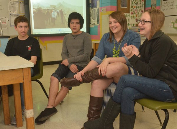 Central Junior High students Matthew Cunningham, from left, Kenny Arredondo, Kyndal Atkinson, and Hannah Harris talk about their experiences during their spring break trip to China. About 75 students from Springdale, Rogers and Fayetteville traveled to China during spring break. 