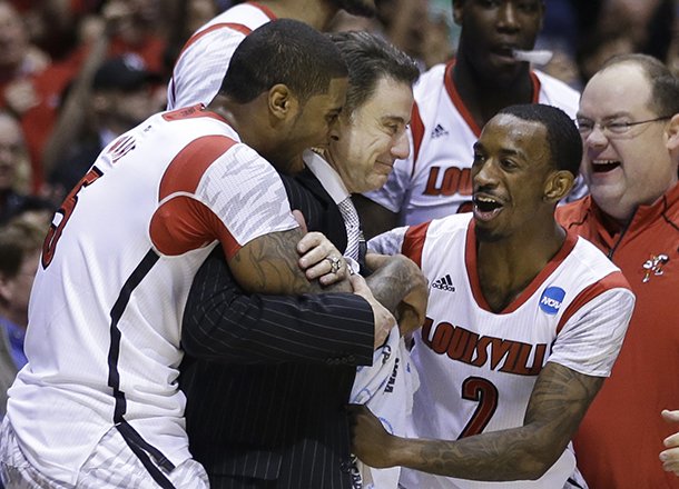 Louisville head coach Rick Pitino celebrates with Chane Behanan, left, and guard Russ Smith (2) after their 85-63 win over Duke in the Midwest Regional final in the NCAA college basketball tournament, Sunday, March 31, 2013, in Indianapolis. (AP Photo/Darron Cummings)