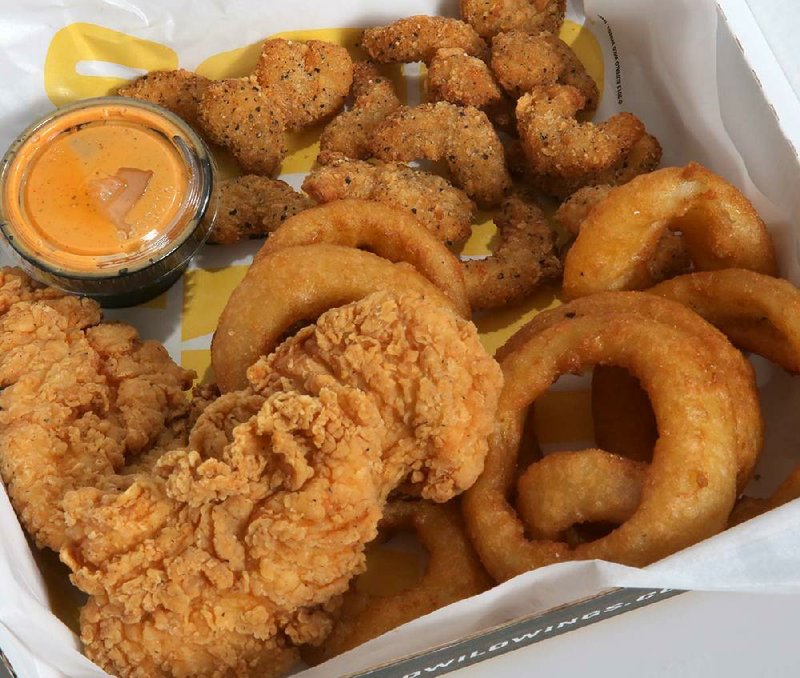 Chicken Tenders & Popcorn Shrimp with onion rings are served at Buffalo Wild Wings in Sherwood. 