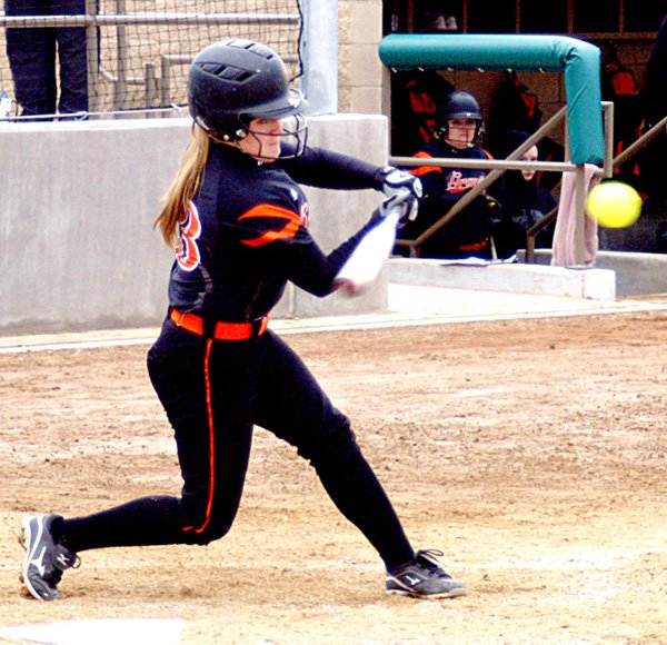 Gravette's lead-off batter, Meagan Ward, knocks one over the fence in the Lady Lions' first at-bat against Ozark on Monday. 