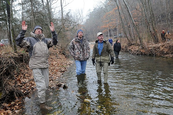Bob Morgan, left, with the Beaver Water District talks about healthy streams while he and Master Naturalist students wade Pine Creek in Madison County on March 23. Students devote 12 Saturdays of classroom and outdoor study to become certified Arkansas Master Naturlists.