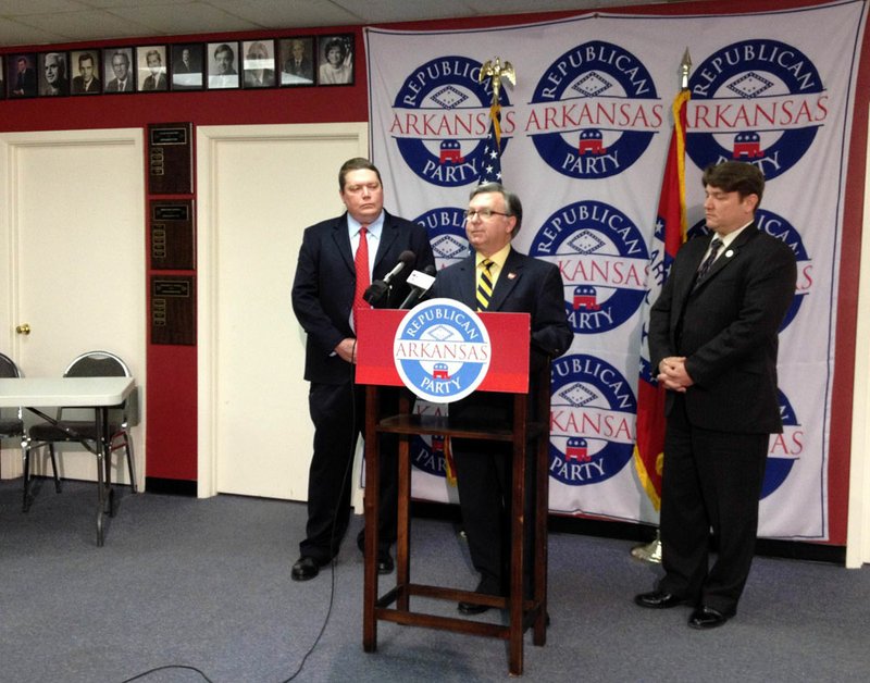 Republican Party of Arkansas Chairman Doyle Webb speaks at a news conference Thursday, April 4, 2013, beside state Sen. Bryan King, R-Green Forest, and Secretary of State Mark Martin.
