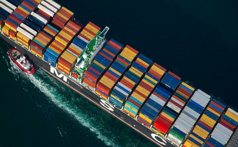 A tugboat guides a container ship into the Port of Long Beach in Long Beach, Calif., in February. U.S. exports climbed to a record $2.19 trillion in 2012 — about 48 percent of President Barack Obama’s goal of $3.14 trillion a year by the start of 2015. 