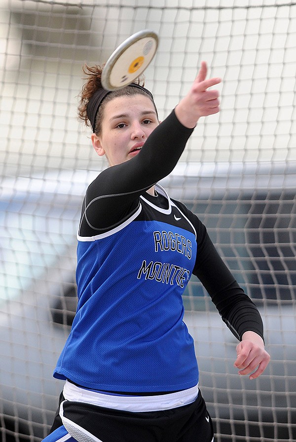 Tori Metheny of Rogers High School throws a discus Thursday, April 4, 2013, at Glenn W. Black Stadium in Siloam Springs during the Panther Relays.