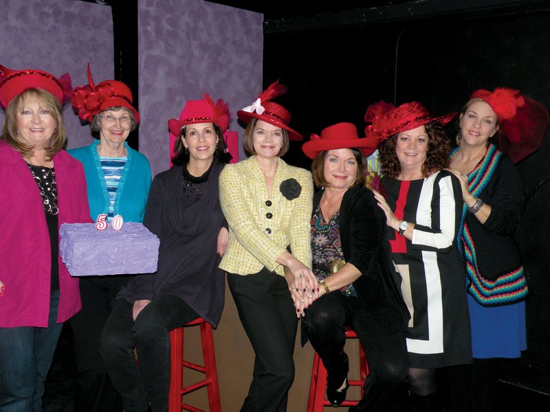 Cast members in the upcoming Conway Community Arts Association’s production of Hats! The Musical are, from the left, Velda Lueders as Mary Ann, Claudia Davis as Lady, Becca Keith as Baroness, Sherry Norrell as Princess, Donna Hutchinson as Contessa, Wendy Shirar as Dame and Cindy Romeo as Duchess. The musical, which is a tribute to the Red Hats Society, will be presented April 19-21 and April 26-28 at The Lantern Theatre in downtown Conway. 