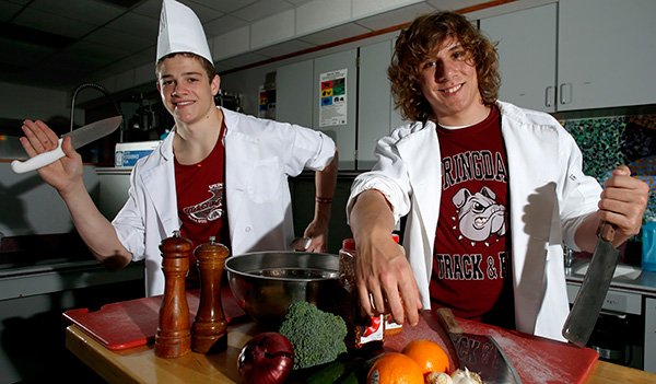 Brayden Mayo, a triple jumper on the Springdale High School track and field team, and Kyle Rill, a high jumper, are also involved with the schools culinary arts program. 