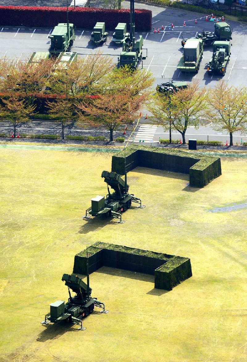 This aerial photo shows units of Japan Air Self-Defense Force's PAC-3s deployed at Defense Ministry in Tokyo Tuesday, April 9, 2013. Japan has deployed missile interceptors in key locations around Tokyo as a precaution against a possible North Korean ballistic missile tests. (AP Photo/Kyodo News) JAPAN OUT, MANDATORY CREDIT, NO LICENSING IN CHINA, HONG KONG, JAPAN, SOUTH KOREA AND FRANCE
