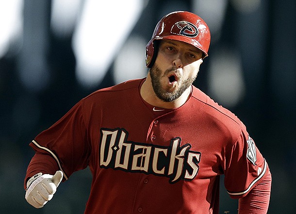Arizona Diamondbacks' Eric Hinske rounds the bases after his two-run home run against the Milwaukee Brewers during the 11th inning of a baseball game, Sunday, April 7, 2013, in Milwaukee. (AP Photo/Jeffrey Phelps)