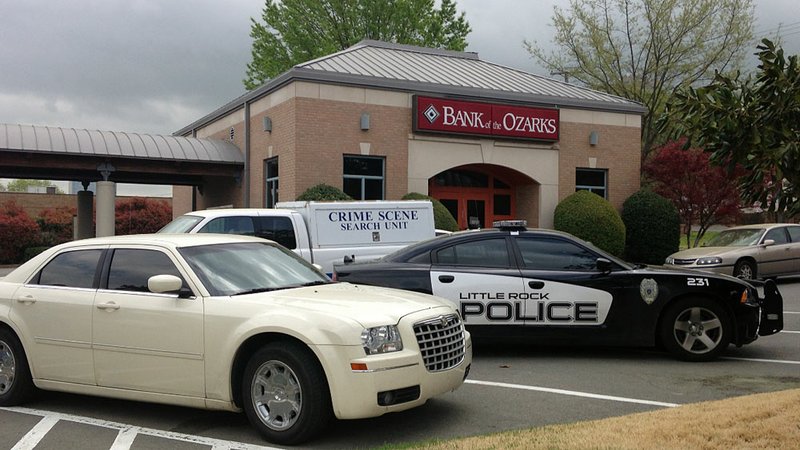 Police respond Wednesday, April 10, 2013, to the Bank of the Ozarks branch at 109 N. Chester St. in downtown Little Rock after a report of a robbery.