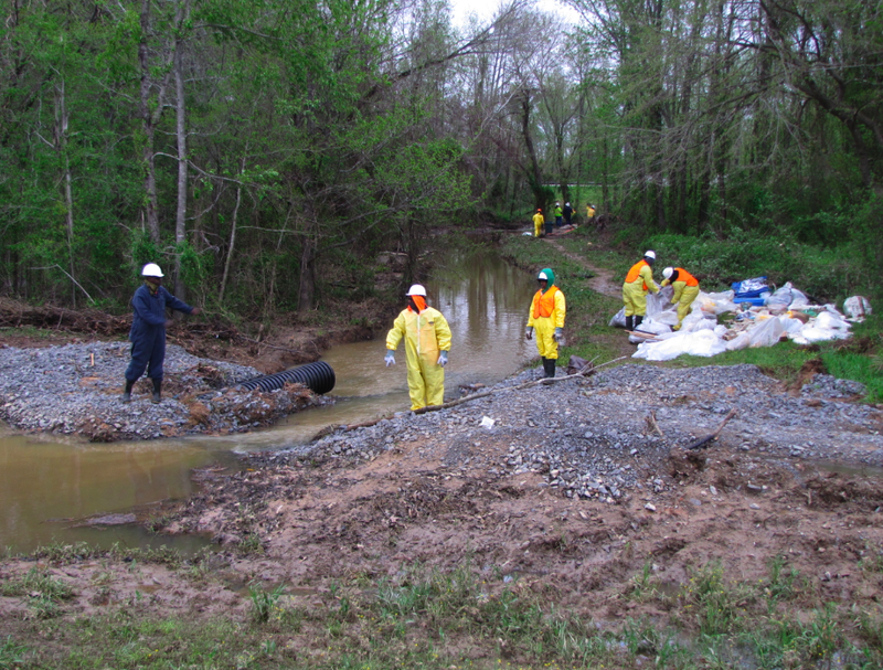 Workers on Thursday continue clean-up operations in Mayflower after an oil line rupture spilled thousands of gallons into the community last month.