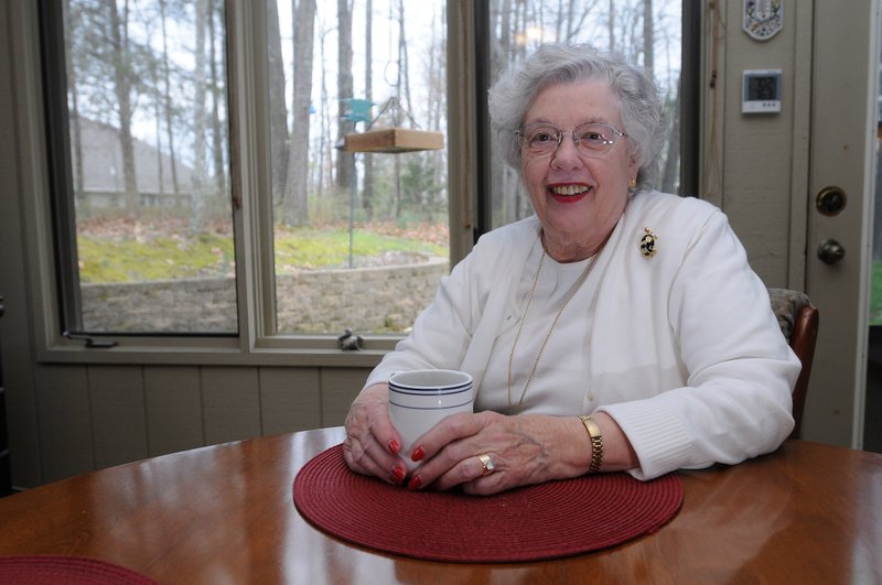 Margaret Christensen, education coordinator for the Schmieding Center in Bella Vista, sits in her sun room Monday, April 8, 2013, at her home in Bella Vista. Christensen said she and her husband spend approximately 90 percent of their time in the day in the sun room.
