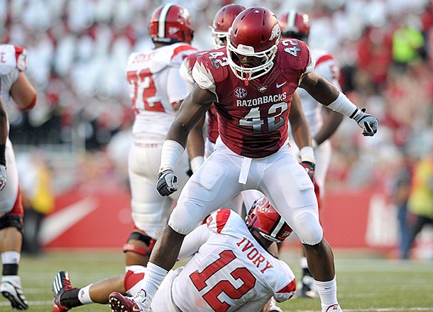 Arkansas defender Chris Smith reacts after taking down Jacksonville State quarterback Marques Ivory in the second quarter of a Sept. 1, 2012 game at Razorback Stadium in Fayetteville.