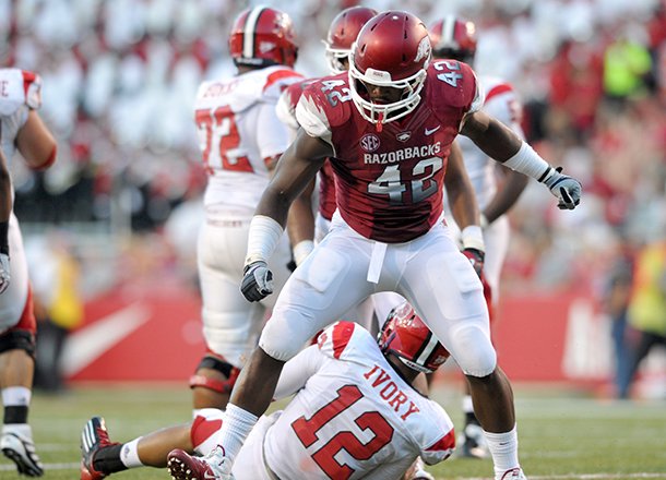 Arkansas defender Chris Smith reacts after taking down Jacksonville State quarterback Marques Ivory in the second quarter of a Sept. 1, 2012 game at Razorback Stadium in Fayetteville.