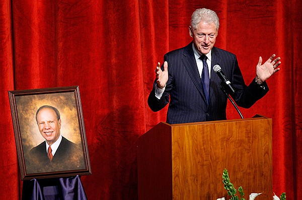 Former President Bill Clinton speaks during a memorial service for Fayetteville District Judge Rudy Moore on Saturday, April 13, 2013, inside the Fayetteville High School Performing Arts Center. Moore, 69, died on Thursday.