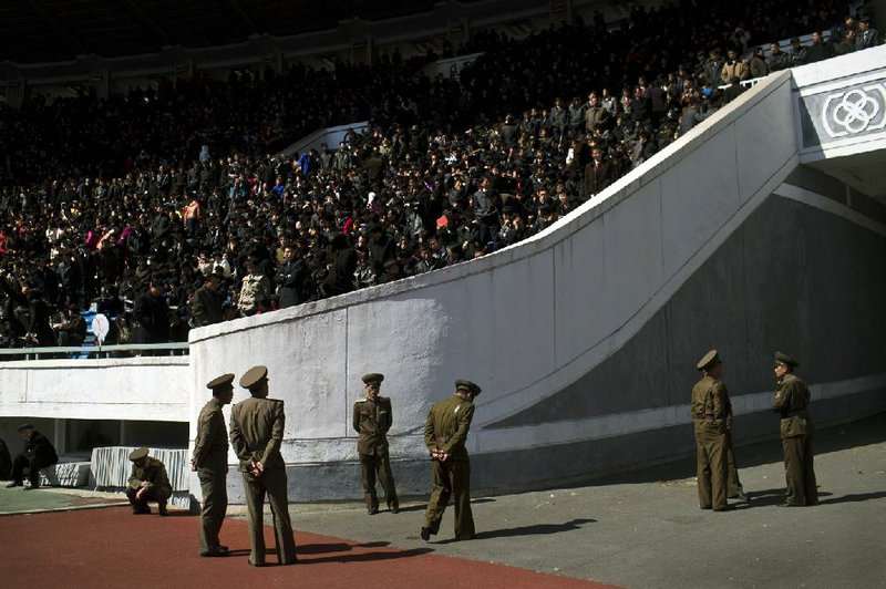 North Korean soldiers stand guard inside Pyongyang’s Kim Il Sung Stadium on Sunday for the 26th Mangyongdae Prize Marathon to mark today’s birthday of the late leader Kim Il Sung. 