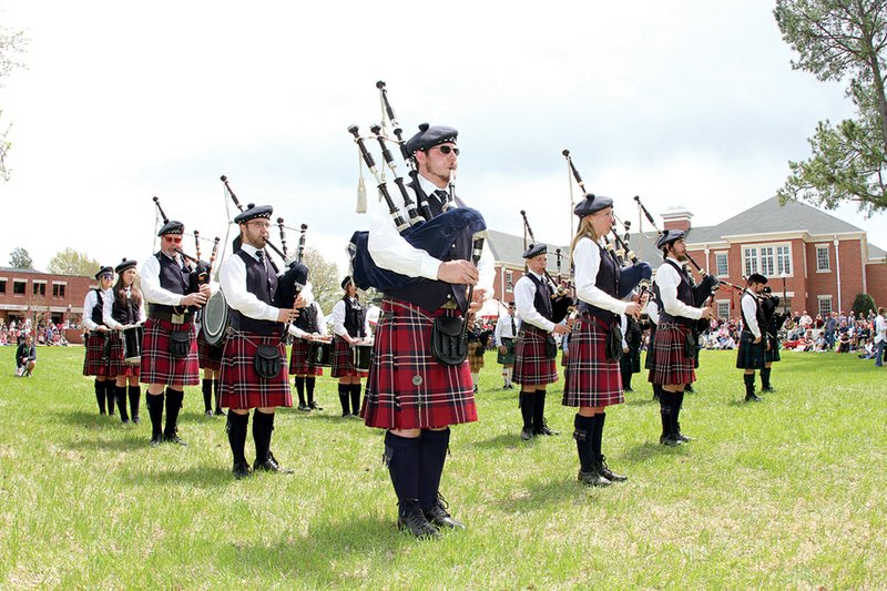 Members of the Lyon College Pipe Band and the Northeast Arkansas Caledonian Pipes and Drums perform at the opening ceremonies of the 34th annual Arkansas Scottish Festival held at Lyon College in Batesville on April 12-14. 