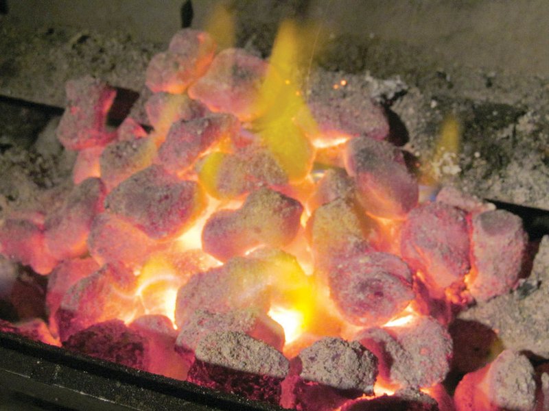 When using charcoal, the briquettes should be gray, ashy and still glowing for just the right temperature. This fire can be for direct or indirect cooking.