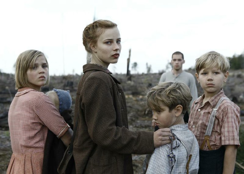 Lore (Saskia Rosendahl, center) is a refugee in Germany immediately after World War II in Lore. 