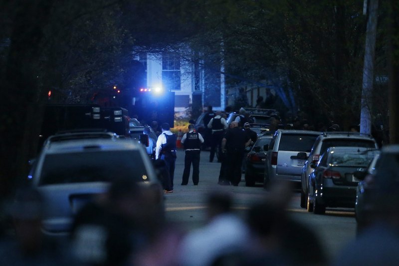 Law enforcement search for the 19-year-old suspect Dzhokhar Tsarnaev in the Boston Marathon bombings, Friday, April 19, 2013, in Watertown, Mass. Tsarnaev was taken into custody shortly before 9 p.m. EST.