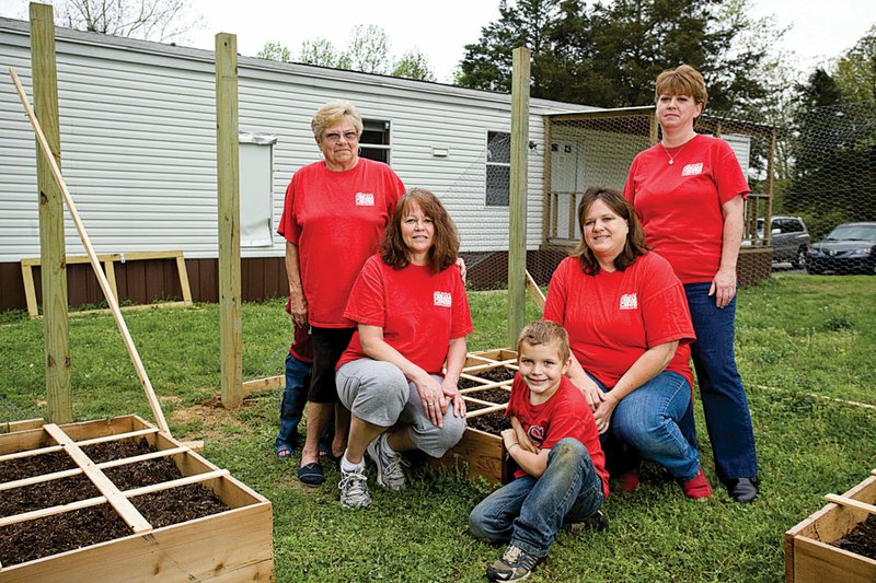 From the left, Carolyn Jackson, Linda Bee, Caden Long, Donna Baugh and Traci Tutor of the Arkansas Dream Center-Heber Springs are shown in Cindy’s Garden. The project teaches gardening skills as well as how to eat a healthy diet.