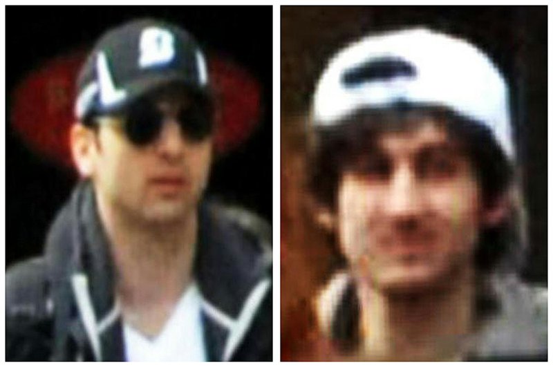 This combo of photos released by the Federal Bureau of Investigation early Friday, April 19, 2013, shows suspects Tamerlan Tsarnaev, left, and Dzhokhar Tsarnaev, right, walking through the crowd in Boston on Monday, April 15, 2013, before the explosions at the Boston Marathon.