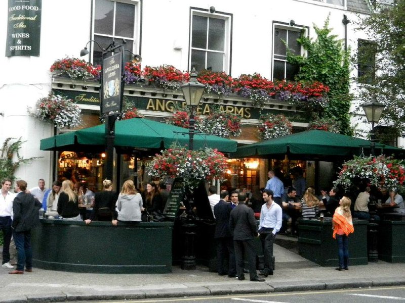 The terrace of the Anglesea Arms in South Kensington area of London thrives with activity on balmy evenings. 