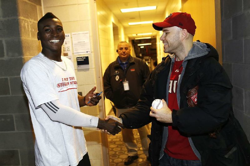 Zack Hample (right) shakes hands with Arizona’s Didi Gregorius after the Diamondbacks’ 6-2 victory over the New York Yankees. Hample caught Gregorius’ home run in the third inning and another home run by the Yankees’ Francisco Cervelli in the ninth. It marked the second time Hample has caught two home run balls in a game. Hample has caught 29 home run balls in all. 