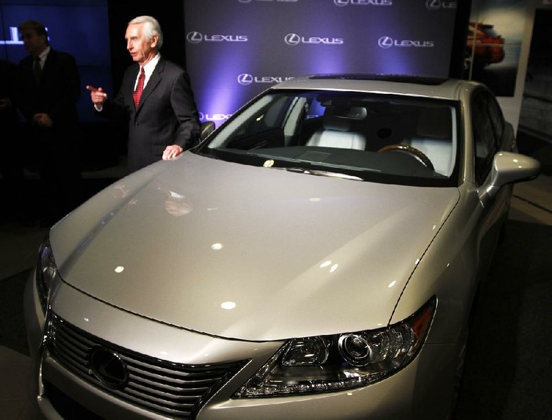 Kentucky Gov. Steve Beshear stands next to a 2013 Lexus after announcing that Toyota’s Georgetown Plant will expand to produce the Lexus ES 350. 